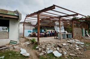 Ms. Miraluna Gonzales Luminario teaches grades four through six in this typhoon-ravaged classroom on Panay Island. Photo credit: Susan Warner for Save the Children